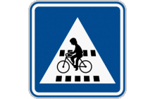 Dopravní značka „Přejezd pro cyklisty“ (č. IP 7) označuje přejezd pro cyklisty vyznačený vodorovnou značkou č. V 8 zejména tam, kde by jej řidič jinak neočekával. TestImage